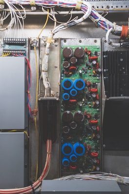 A well-organized electrical circuit board with neatly arranged cables and components.