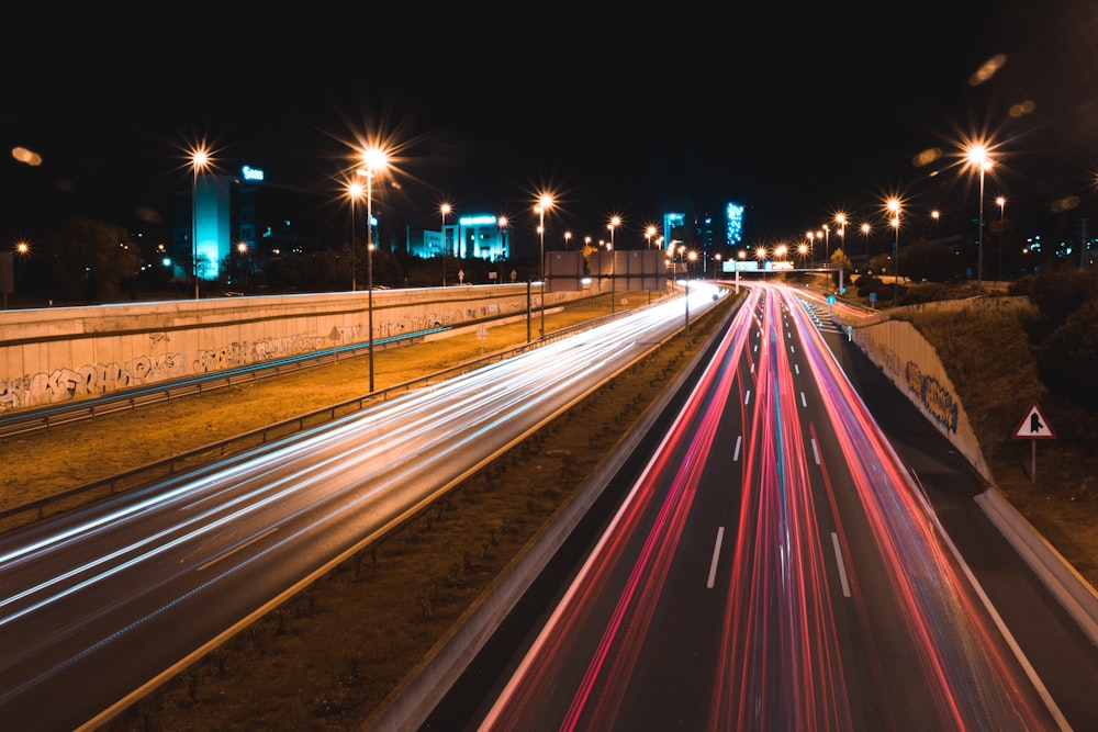 lighted cars passing highway