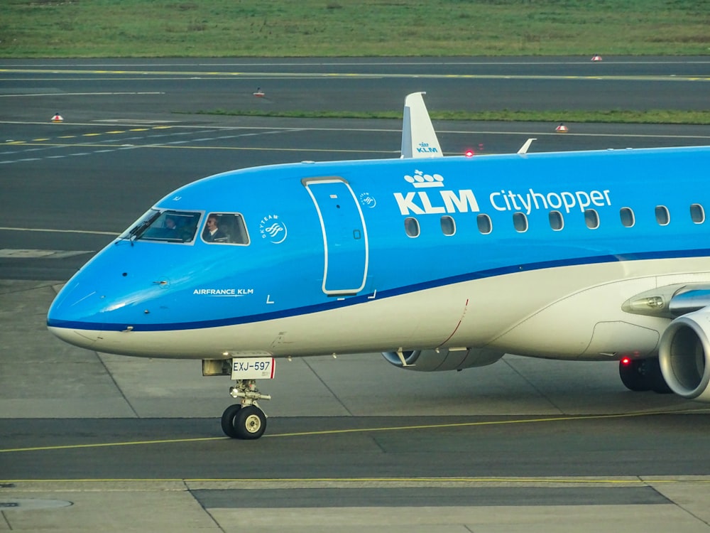 blue and white KLM cityhopper airplane