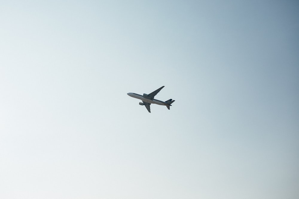 white airplane on air