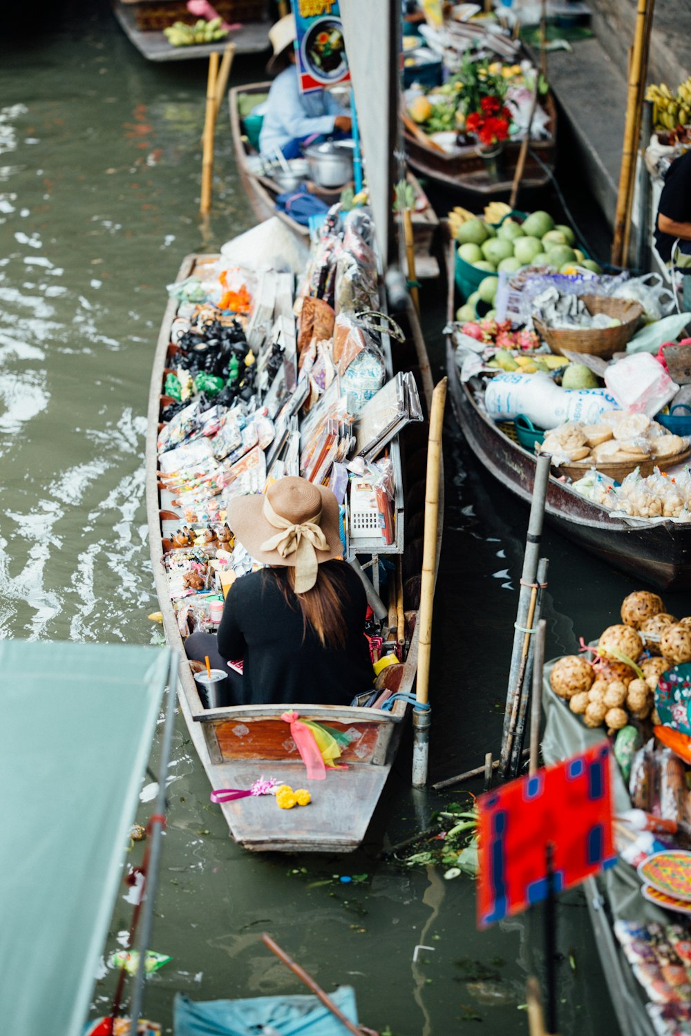 vendors riding boats with vegetables