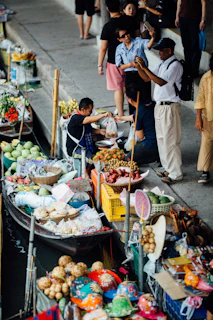 A vibrant photo of Bandung's iconic floating market bustling with visitors enjoying local delicacies.