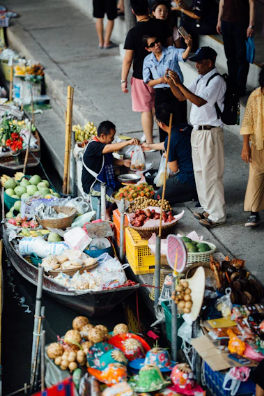 A vibrant photo of Bandung's iconic floating market bustling with visitors enjoying local delicacies.