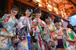five women wearing oriental dresses