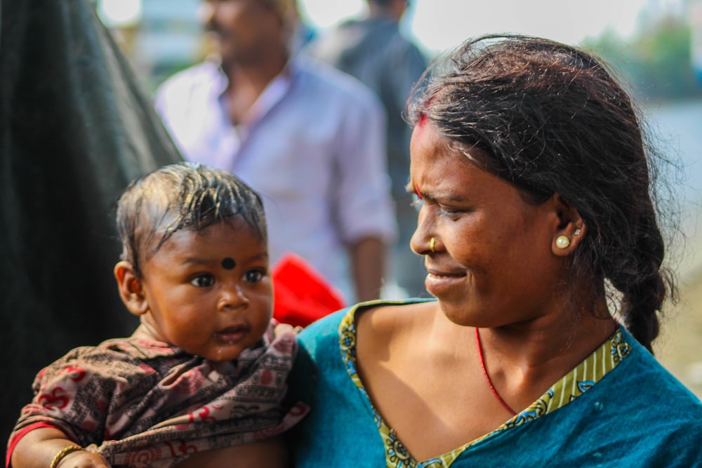 woman carrying baby