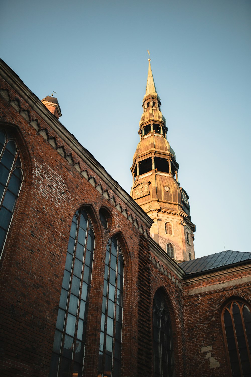 brown brick building under blue sky