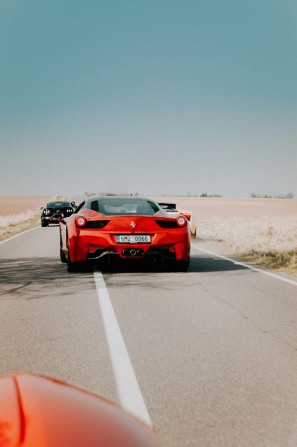 red coupe on road