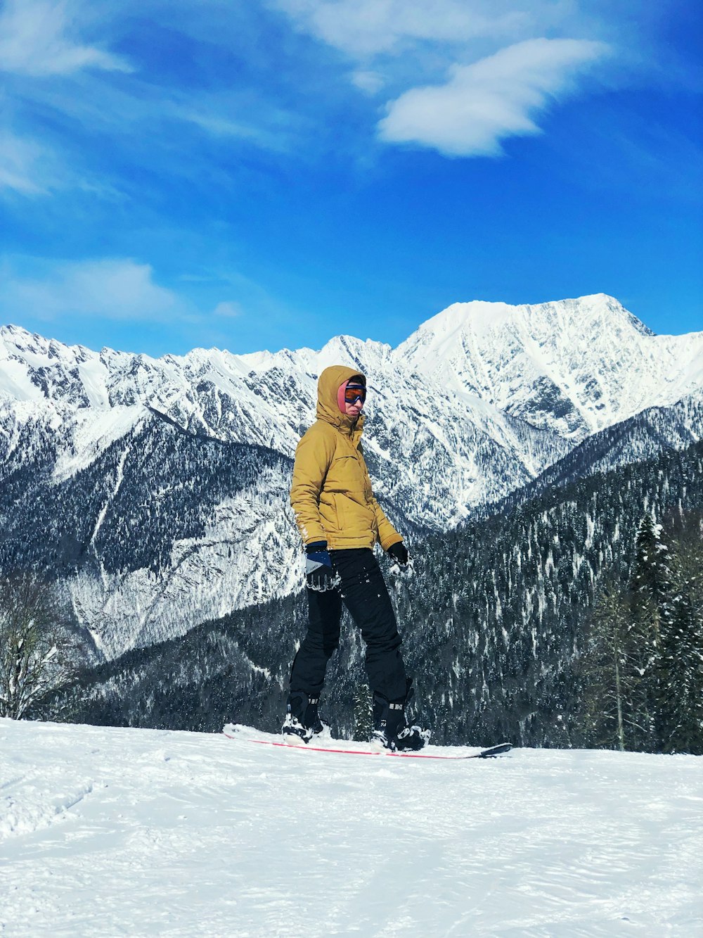 man snowboarding during daytime