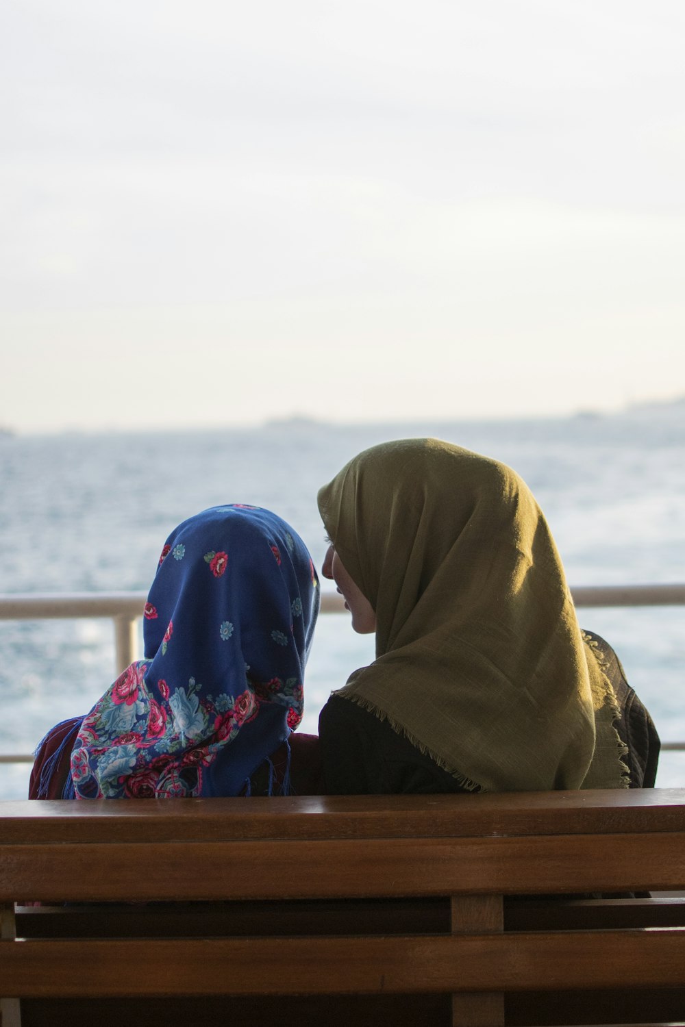 shallow focus photo woman wearing brown hijab headdress