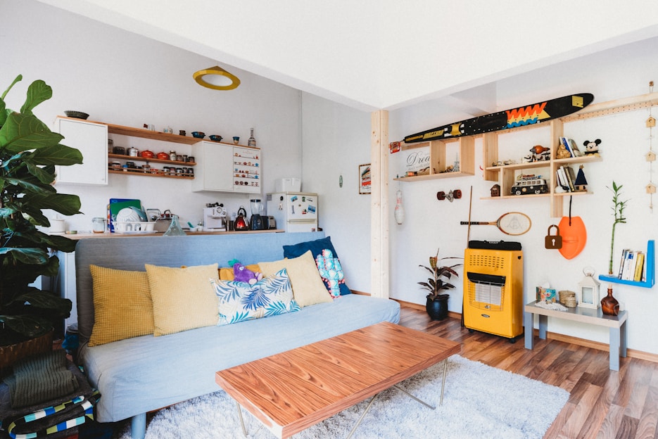 A cozy living room with recycled furniture and decor.