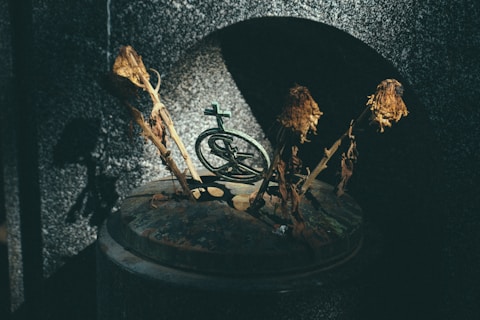 four brown stick on black metal container