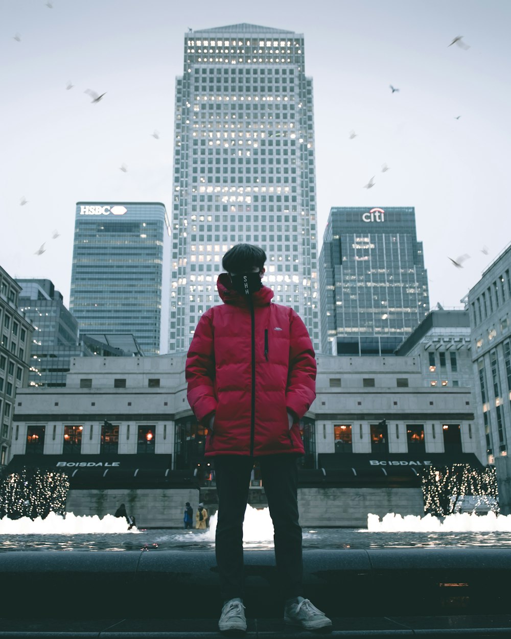 man standing near building