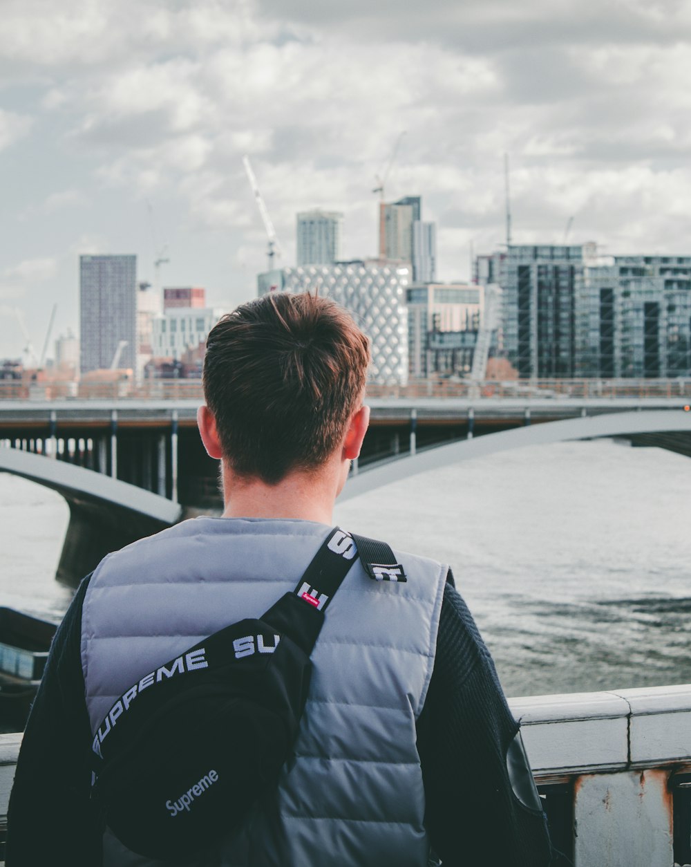 man standing near railings