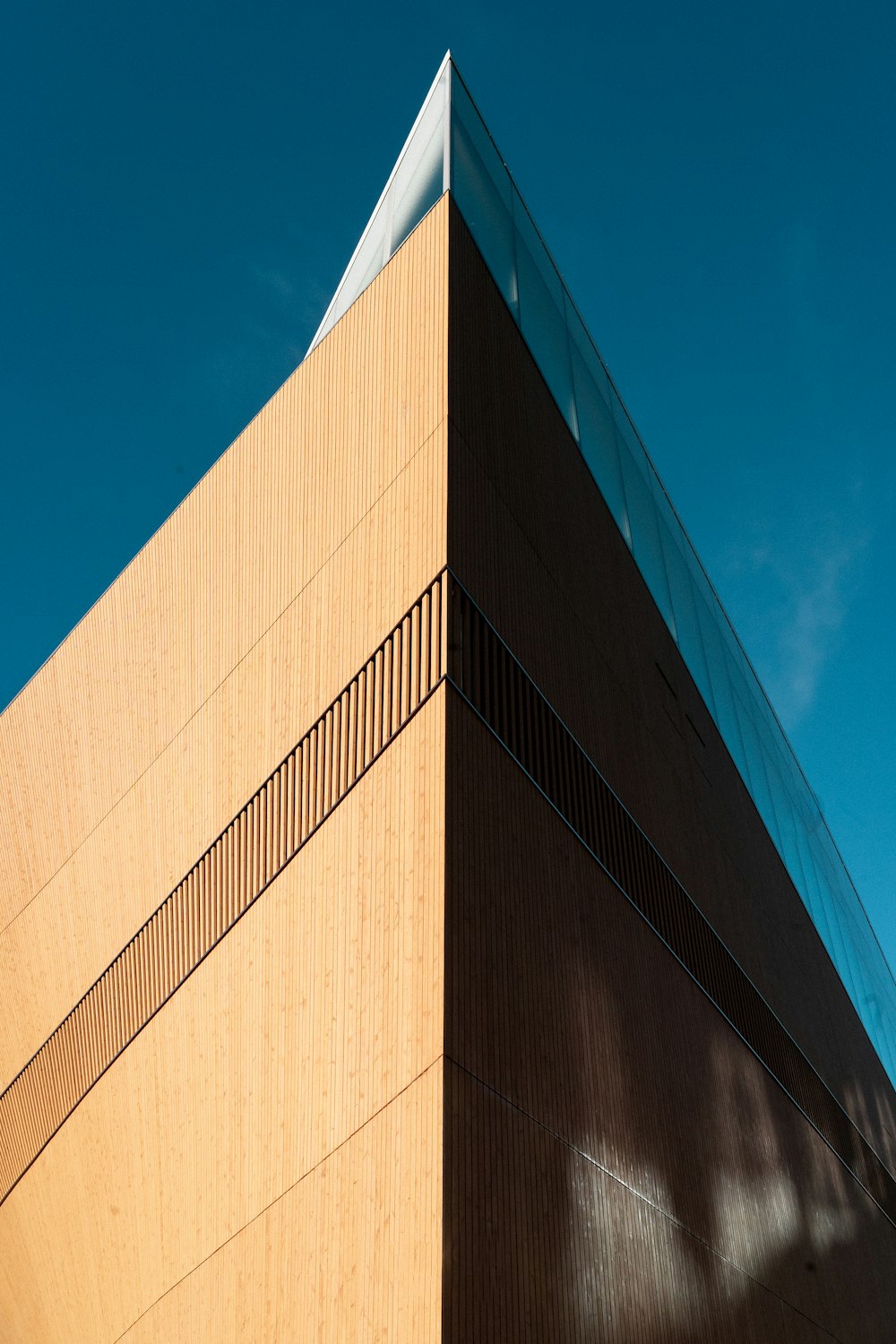 a tall building with a sky in the background