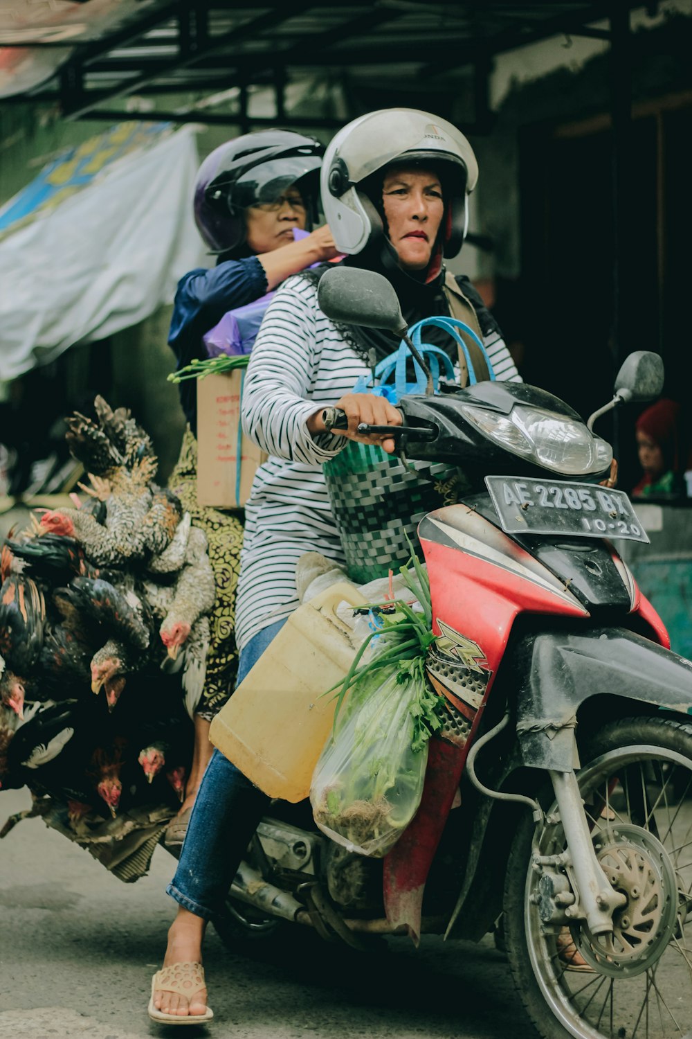 two women riding motorcycle