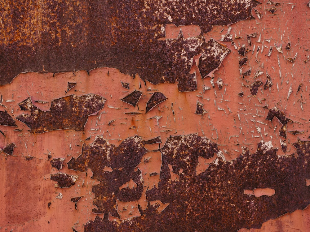 an old rusted metal surface with peeling paint