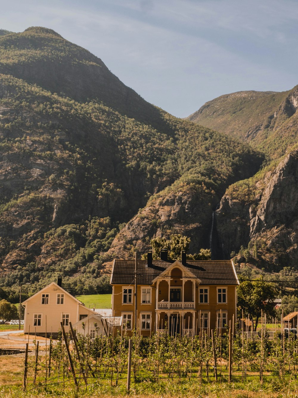 brown concrete house near mountain