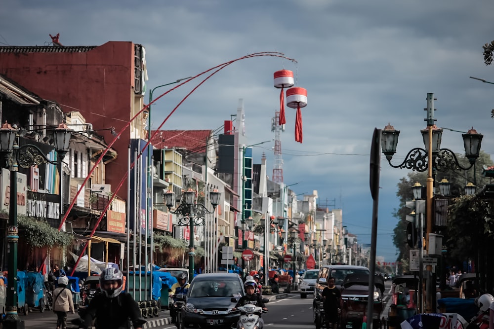 two white-and-red hanging decors near road