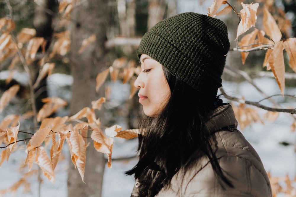 woman wearing black knit cap