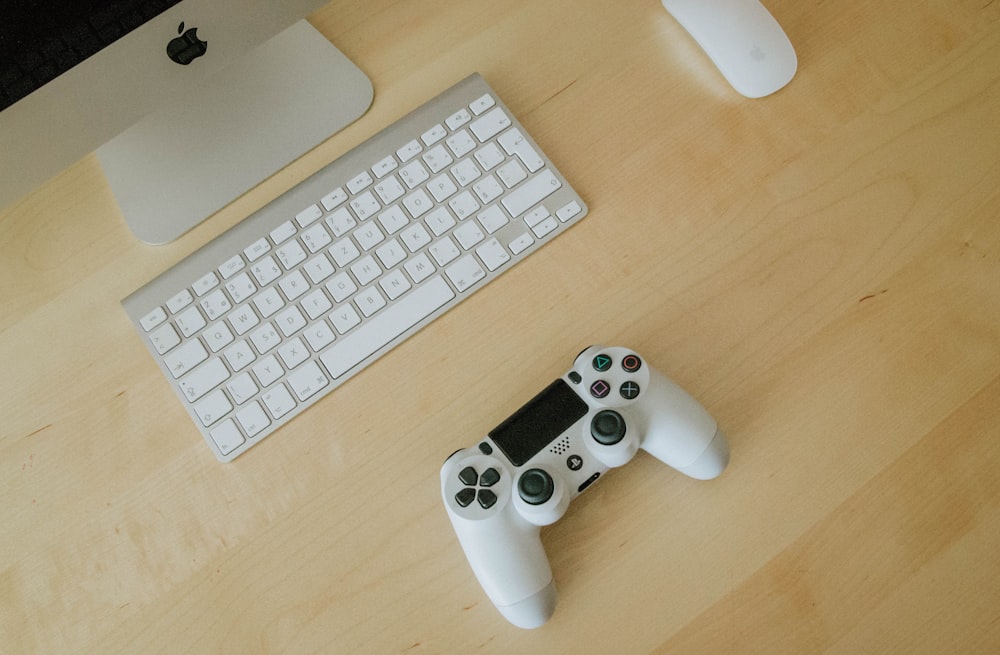 white and black Sony PS4 controller