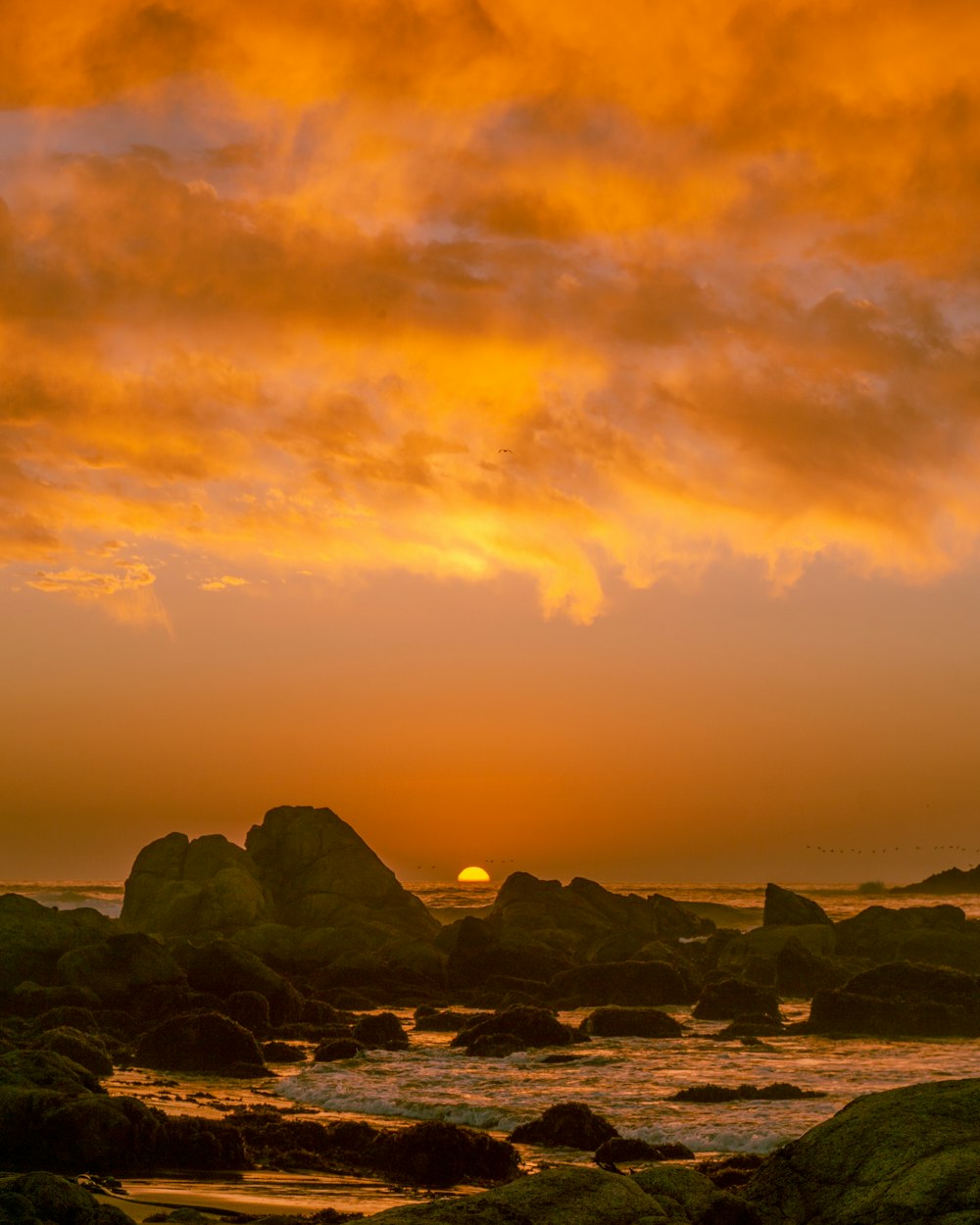 rocks and body of water during golden hour