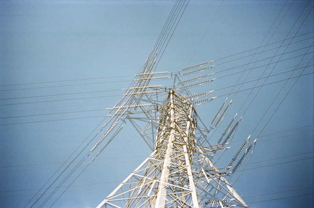 low angle photo of transmission network post