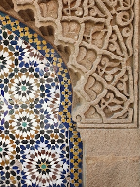 a close up of a decorative tile on a wall