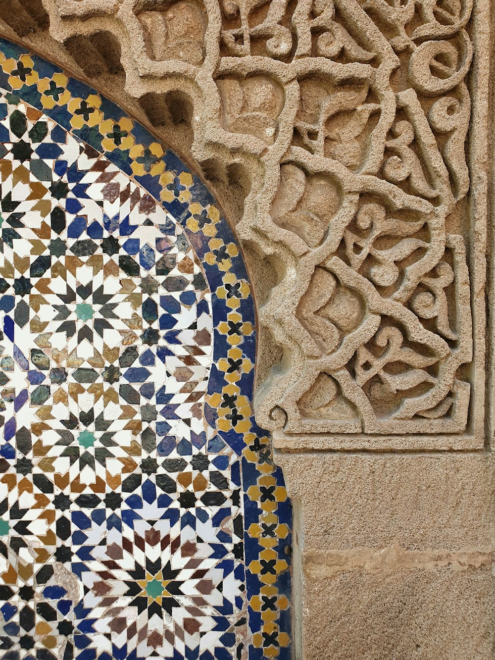 a close up of a decorative tile on a wall