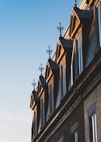 Evening photo of a residential building illuminated to highlight recent repairs and upgrades.