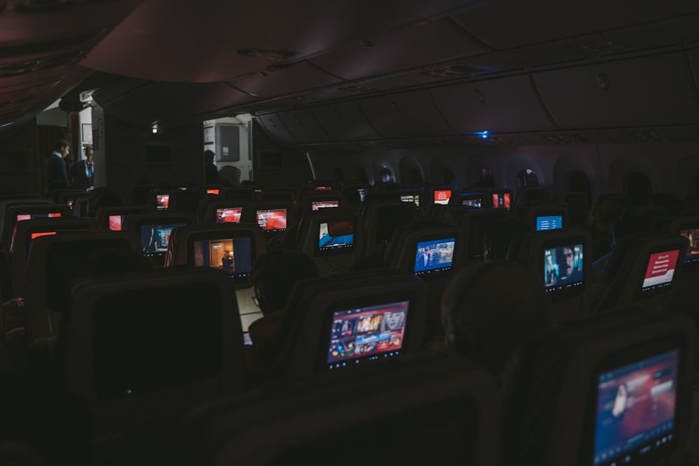 airplane seat with flat screen TV rack