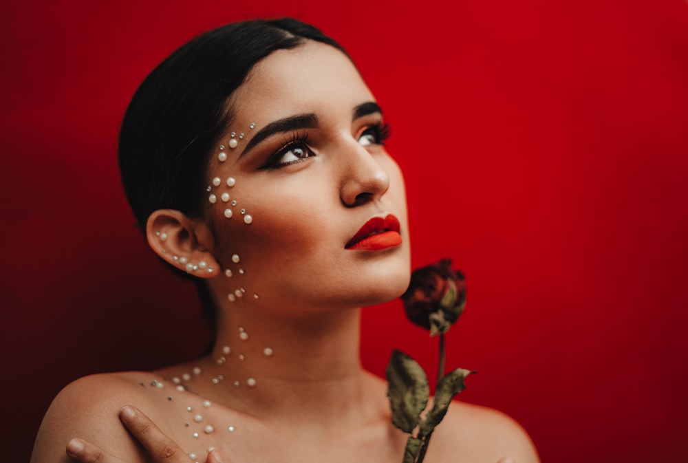 woman holding red rose