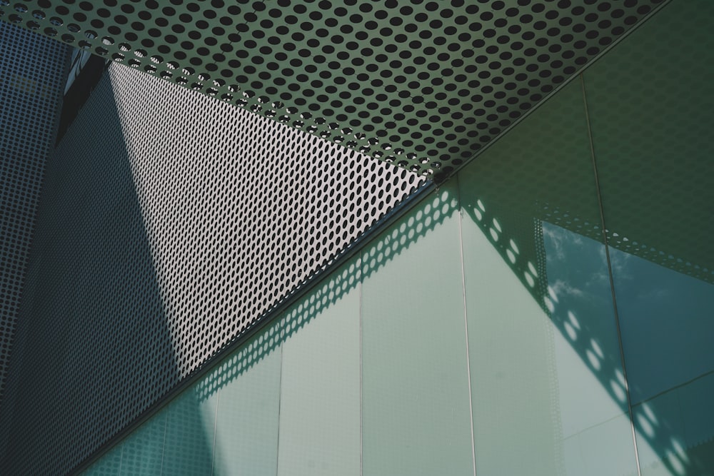 a close up of a metal structure with a sky background