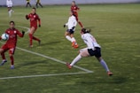 Action shot of a soccer player mid-kick during an intense match