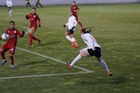 An action-packed moment from a local soccer match captured mid-play.
