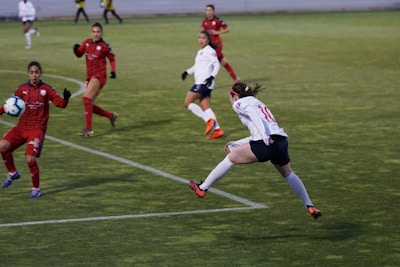 Action shot of a soccer player mid-kick during an intense match