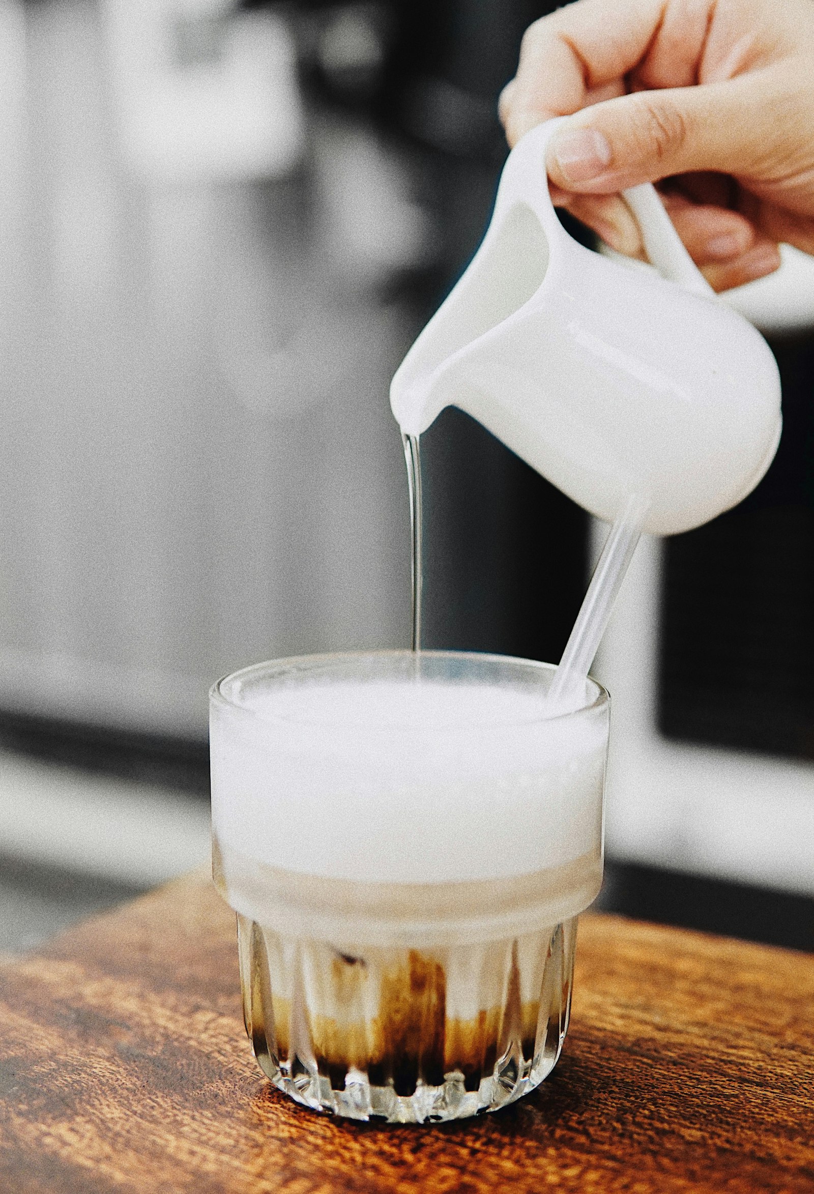 Sigma 30mm F1.4 DC DN | C sample photo. Person pouring liquid on photography