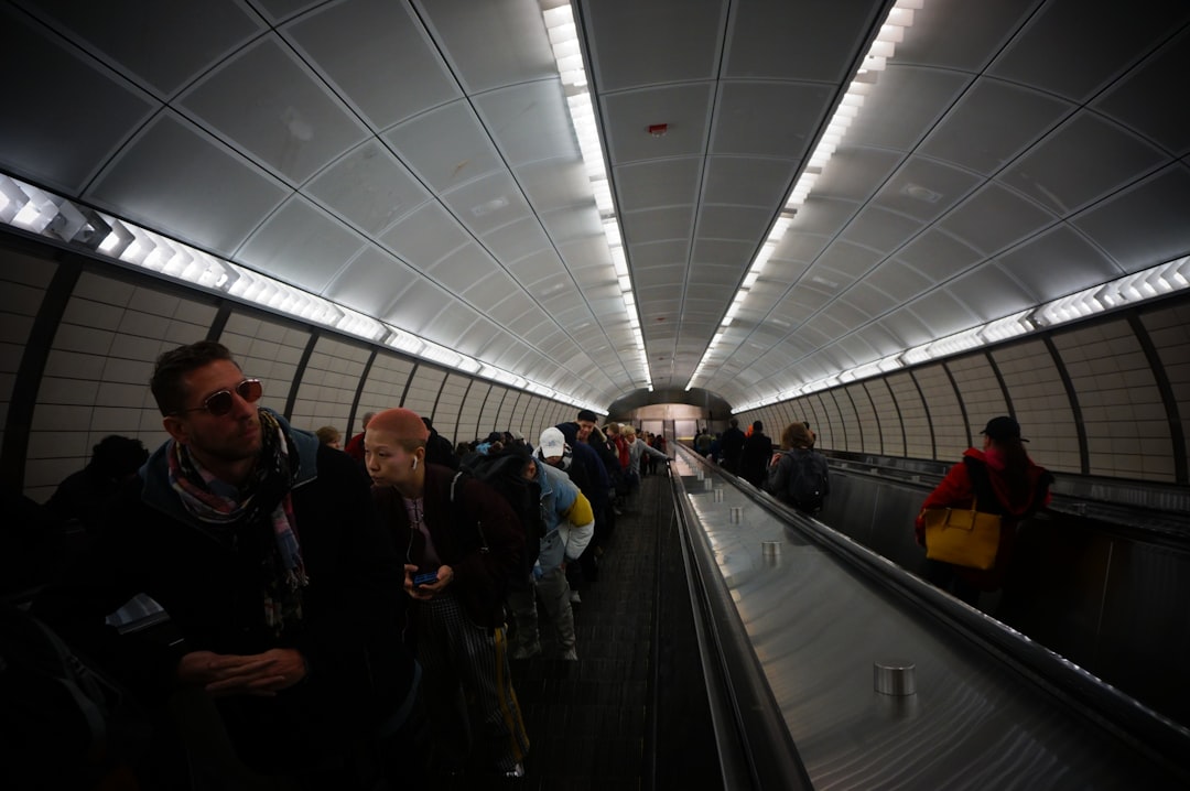 people walking on subway stairs