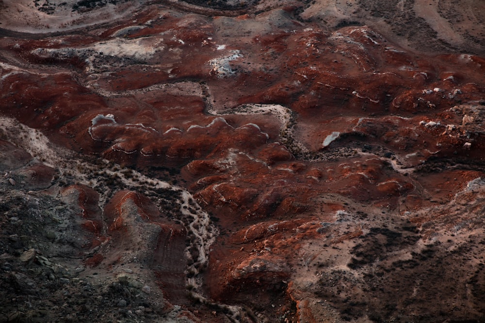 an aerial view of a rocky area with brown and white rocks