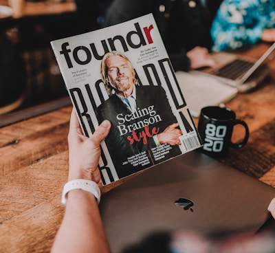 person holding Foundr book