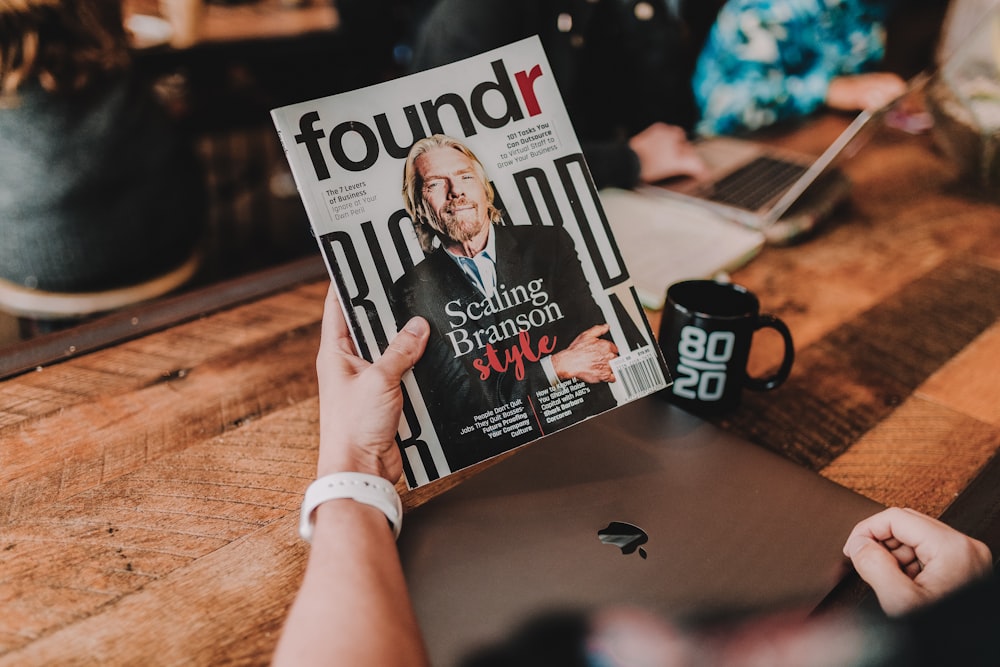 person holding Foundr book