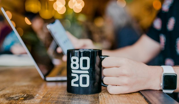 Mug and tablet on a marketing planning desk