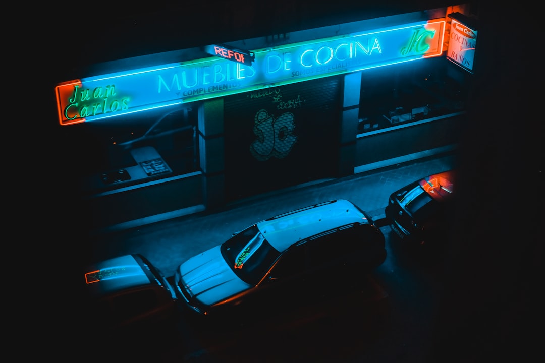 cars parked in front of cafe at night