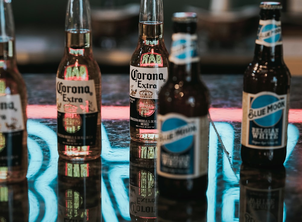 Corona Extra beer bottles on gray marble surface