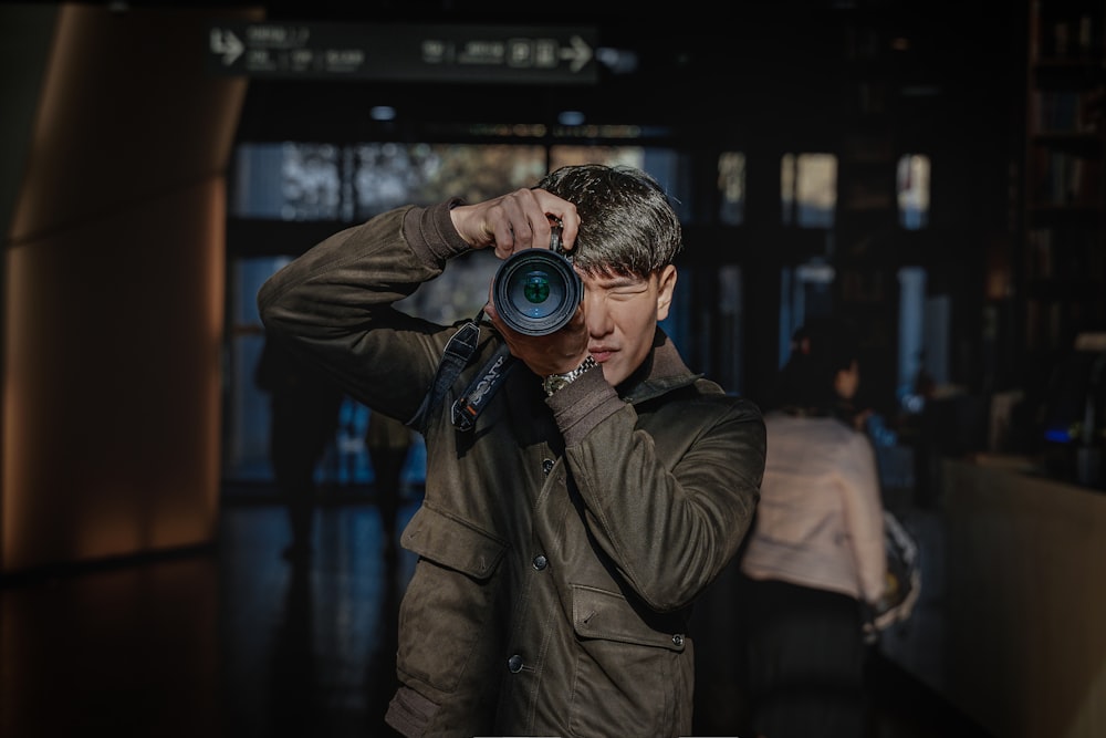 a man taking a picture with a camera