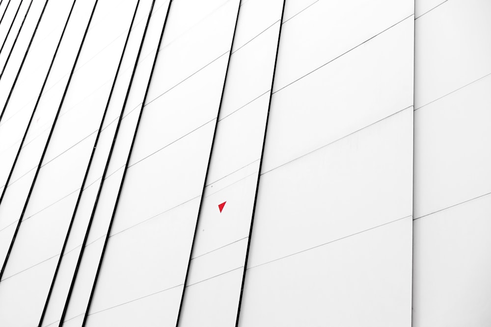 a red object is hanging on the side of a building