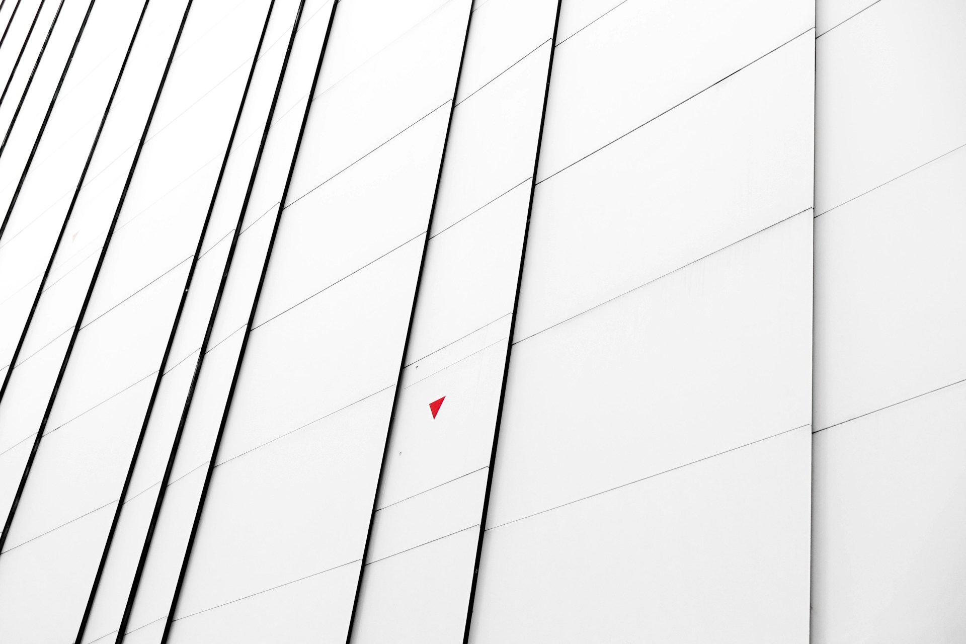 a red object is hanging on the side of a building