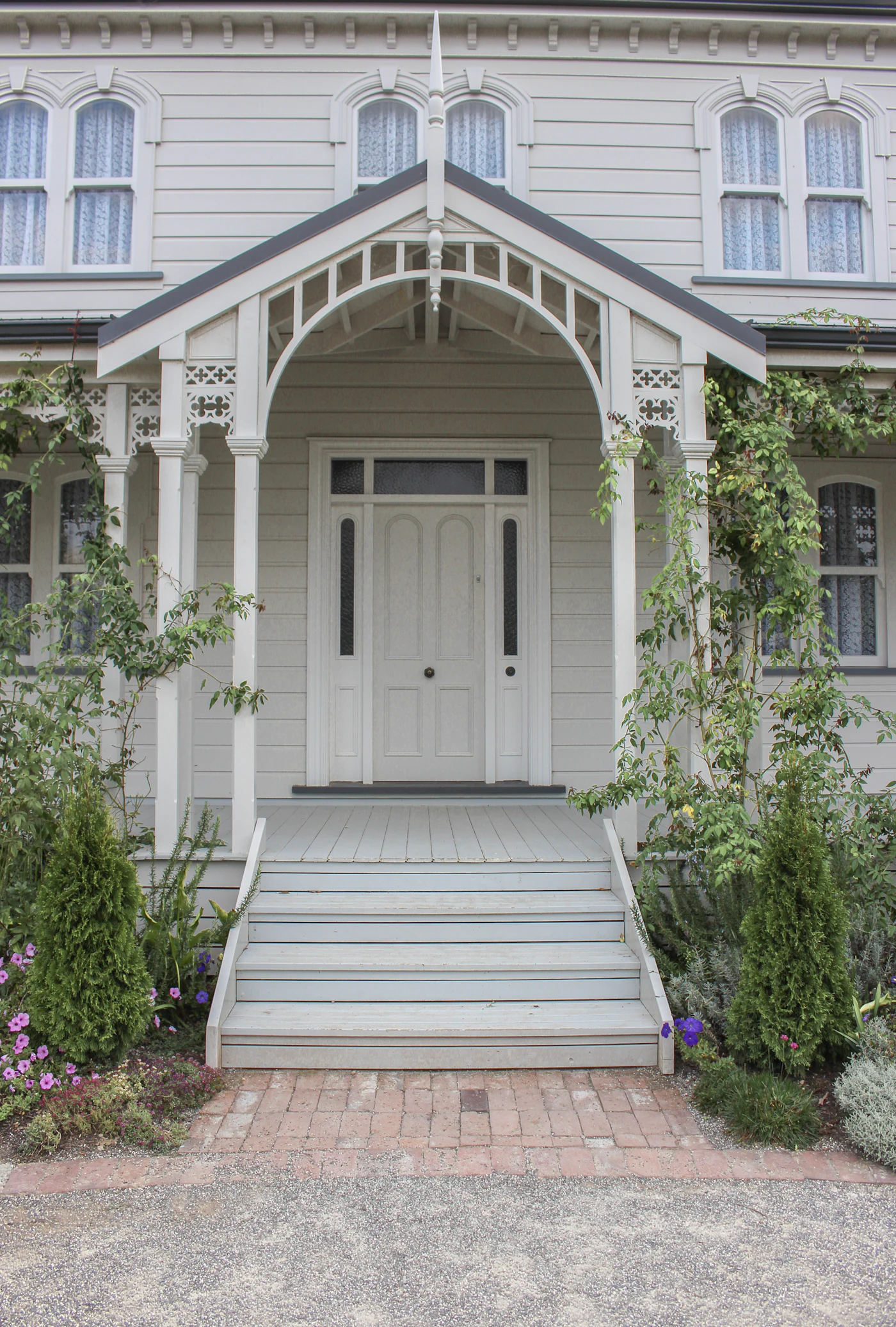 White house with a white front door and porch