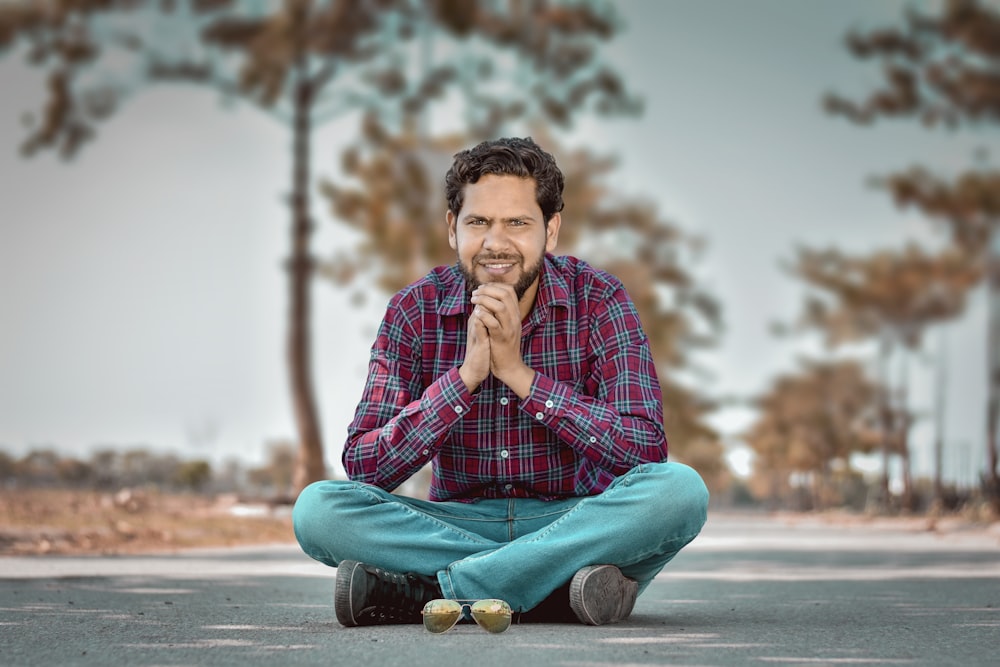 man sitting with legs crossed