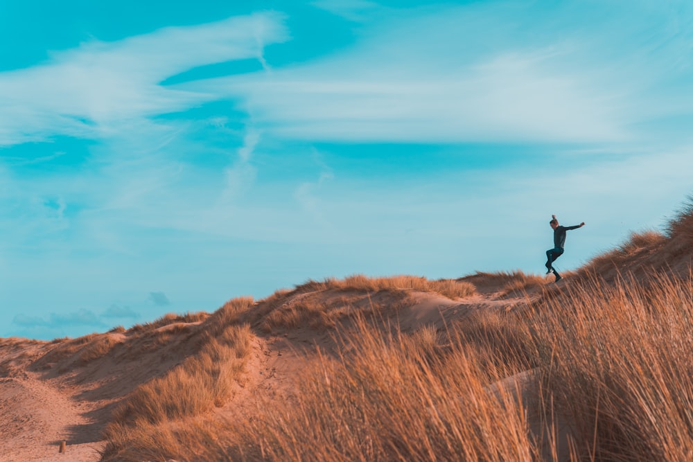 person on brown terrain