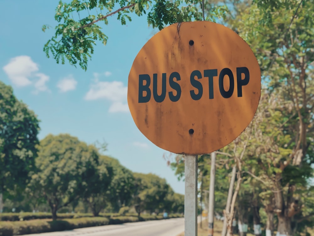 red and black bus stop signage